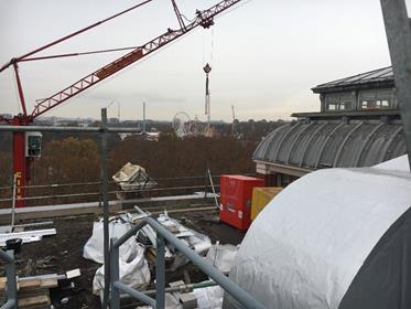 Rooftop Including Crane And Neighboring Park