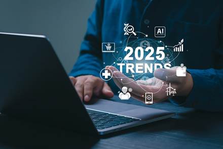 2025 trends concept businessman working on laptop and holding 2025 trends icons on sgreen future technological advancements world business trend online technology new business opportunities