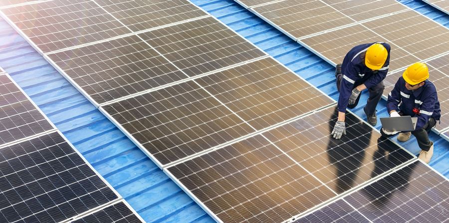 professional inspecting solar panel installations on a rooftop ensuring renewable energy efficiency and sustainability practices highlighting clean energy technologies and environmental benefits