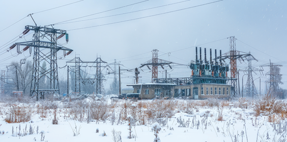 Snowy Power Substation Landscape. Shows Electricity Infrastructure In Winter; Ideal For Energy, Power, And Climate Themes.