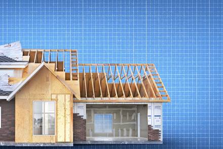 unfinished frame house on a blueprint background 3d illustration