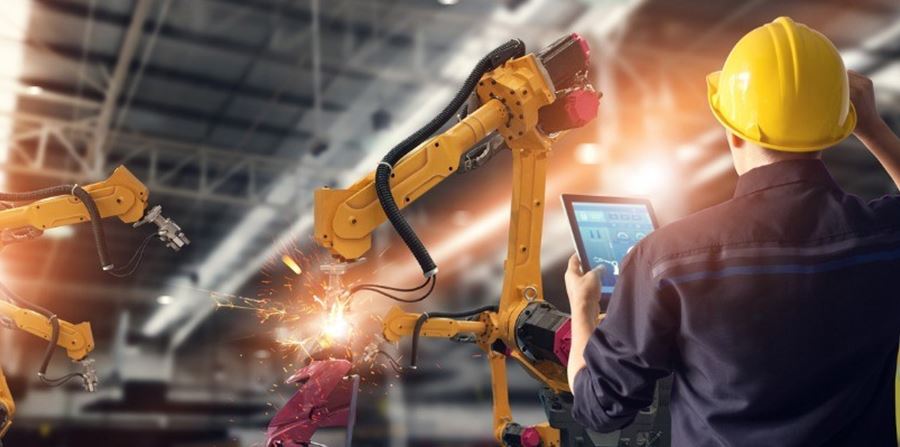 Engineer Using Tablet Check And Control Automation Robot Arms Machine